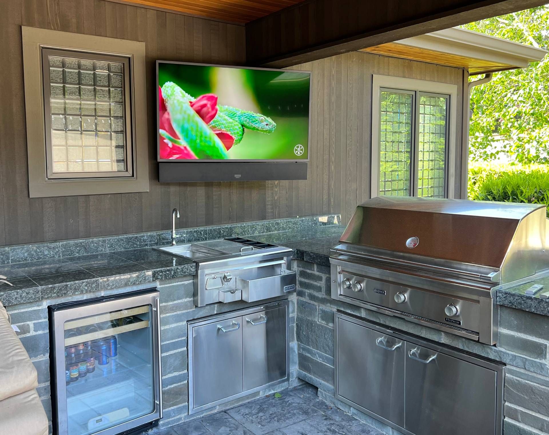 Wall mounted TV in outdoor kitchen
